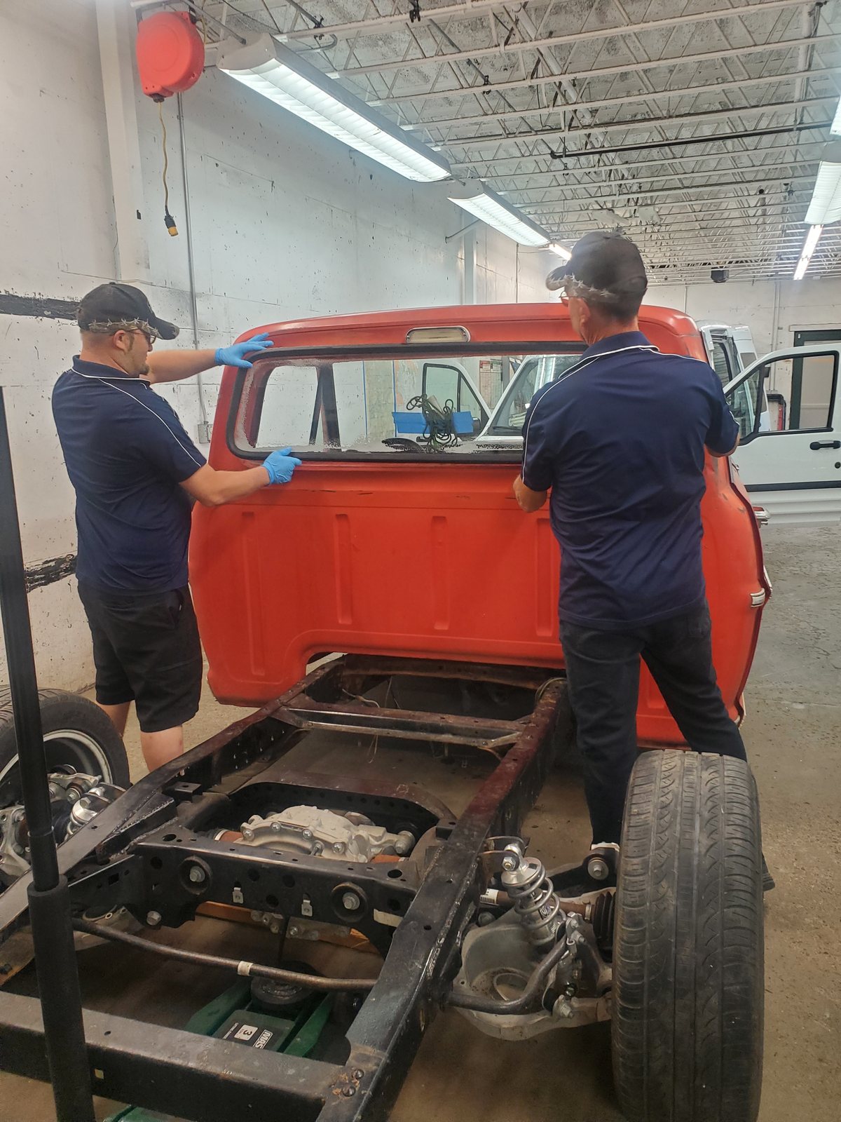 SGI technicians working on a classic Ford pickup restoration