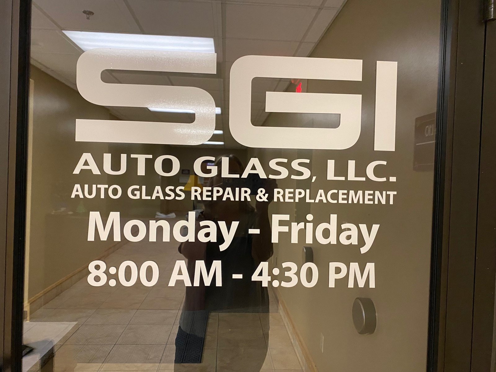The SGI Auto Glass office door, open Monday to Friday 8:00 to 4:30