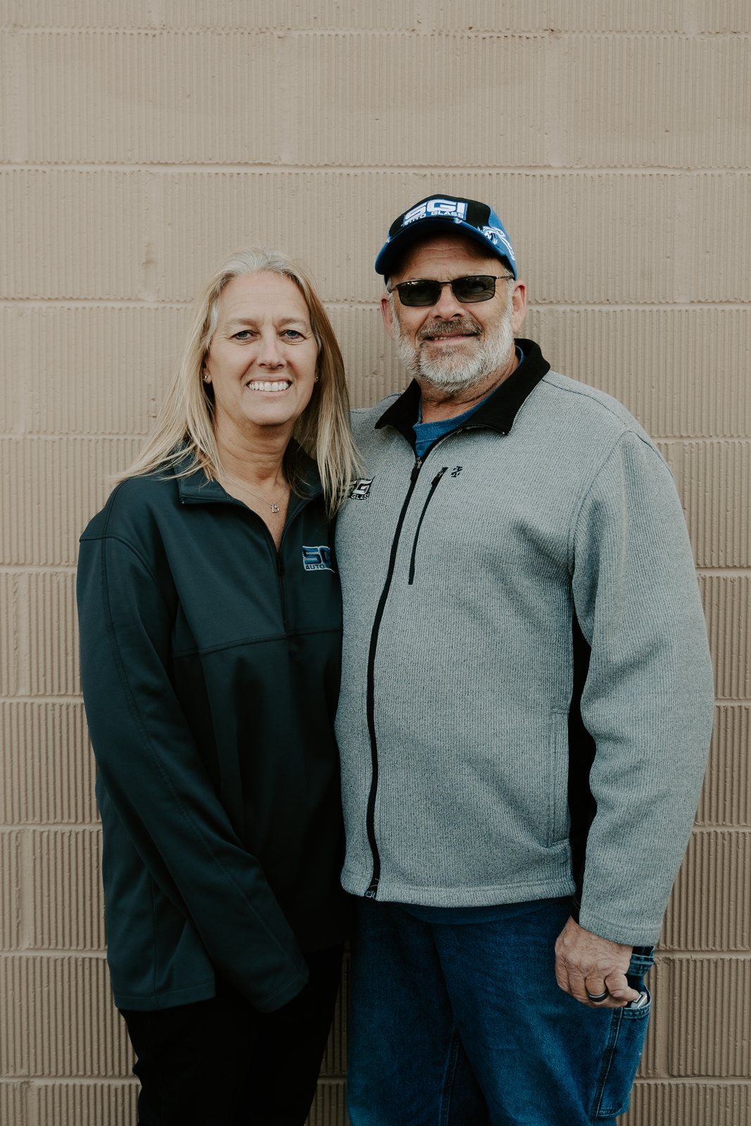 Two members of the SGI Auto Glass team outside the Superior shop